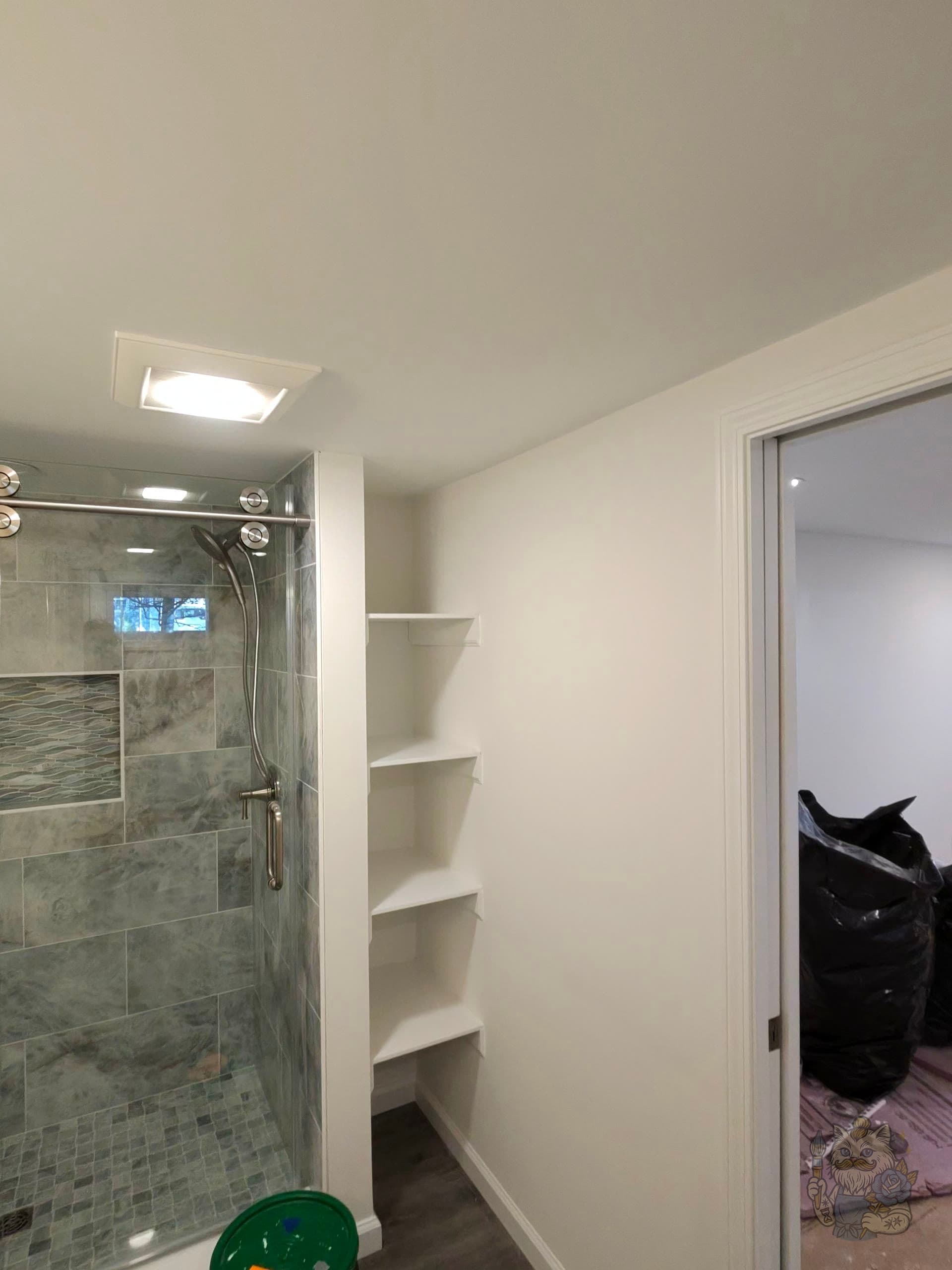 Bathroom interior — freshly-painted built-in shelving and trim by Boho Painting