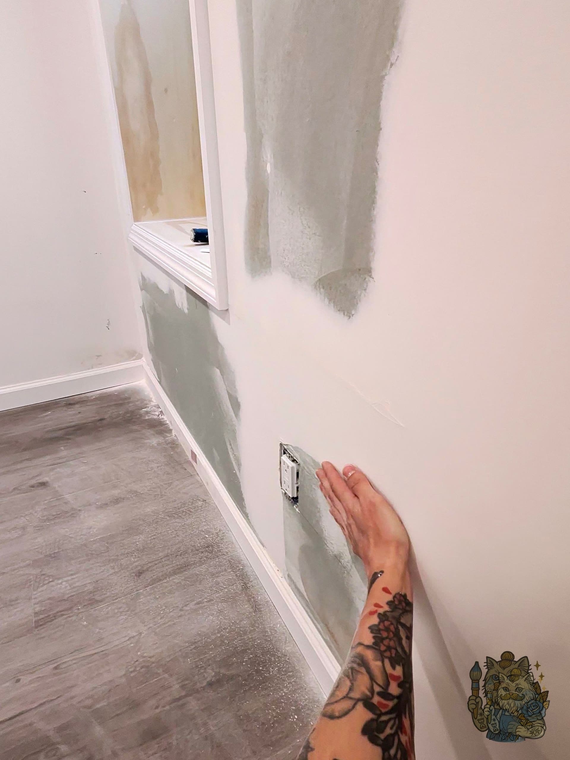 Wall before skimming — hand-checking the surface